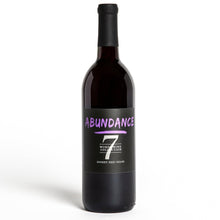 Load image into Gallery viewer, A bottle of abundance wine with purple font and the number seven. The words listed are Abundance, Word Wine Collection, and Sweet Red Wine.
