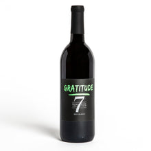Load image into Gallery viewer, A bottle of gratitude wine with green font and the number seven. The words listed are gratitude, Word Wine Collection, and red blend.