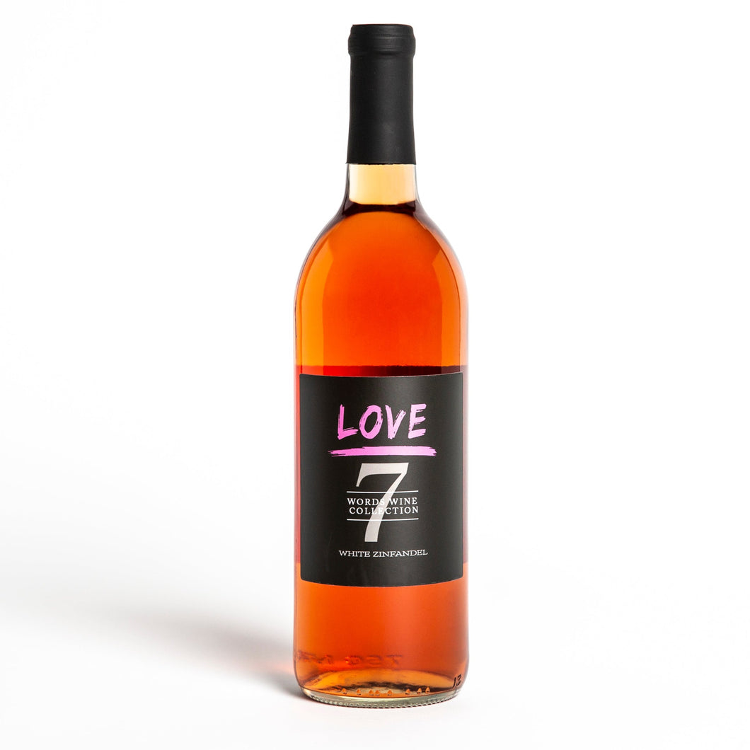 A bottle of love wine with pink font and the number seven. The words listed are love, Word Wine Collection, and white zinfandel.